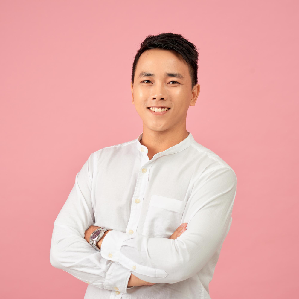 young-asian-male-smiling-laughing-with-arms-crossed